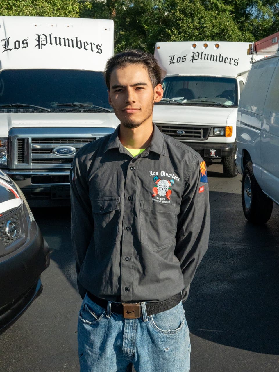 A Los Plumbers technician with the company fleet in Mesa, Arizona