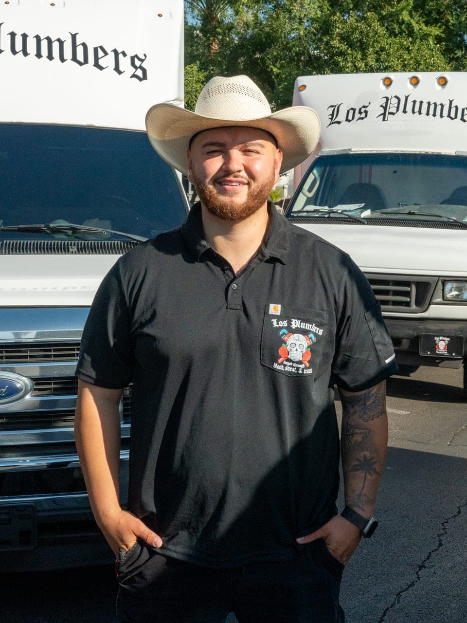 A Los Plumbers technician with the company fleet in Mesa, Arizona