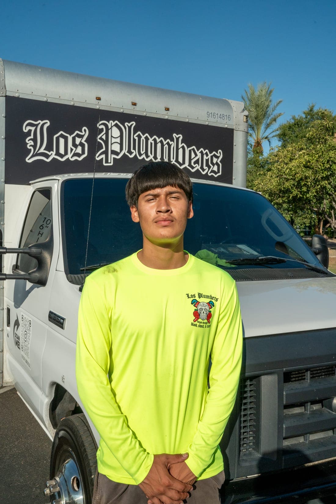 A Los Plumbers technician with the company fleet in Mesa, Arizona