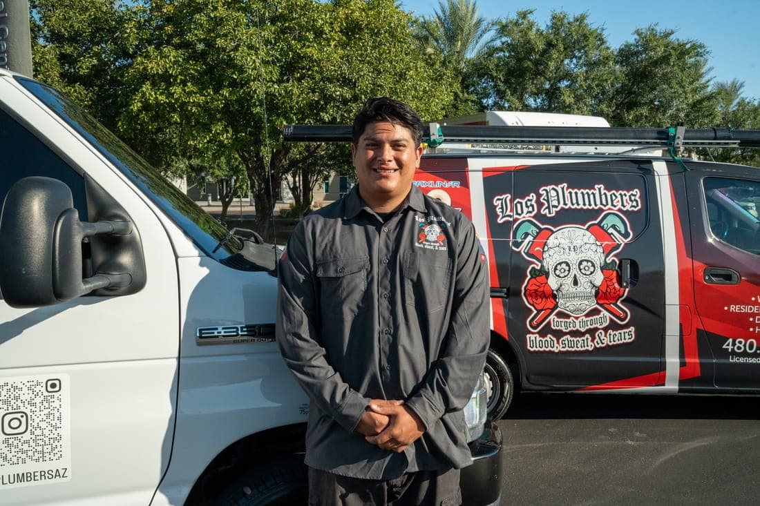 A Los Plumbers technician with the company fleet in Mesa, Arizona